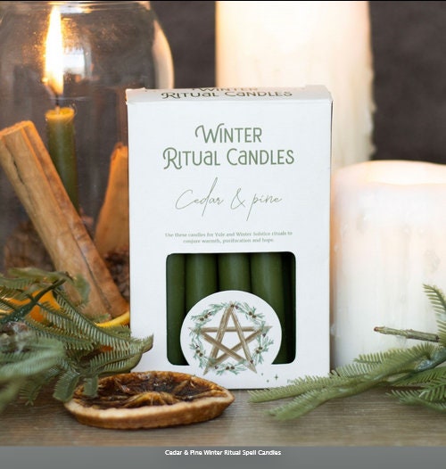 A pack of 12 Winter Ritual candles in a Cedar and Pine fragrance. Etsy